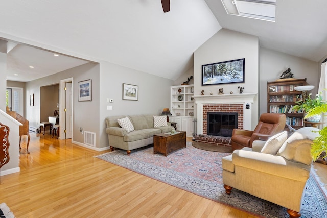 3 Blueberry Rd Unit 3, Yarmouth, ME 04096 - living room with wood finished floors, a fireplace, recessed lighting, a ceiling fan, and vaulted ceiling