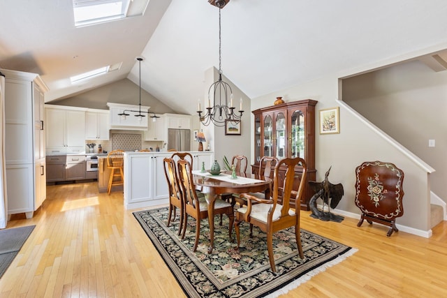 3 Blueberry Rd Unit 3, Yarmouth, ME 04096 - dining space featuring a skylight, light wood finished floors, lofted ceiling, a chandelier, and stairs