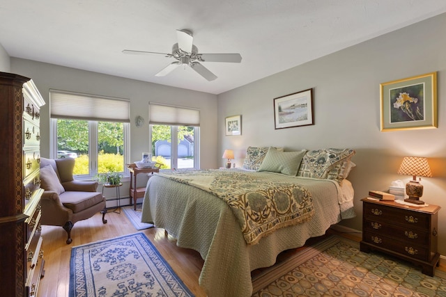 3 Blueberry Rd Unit 3, Yarmouth, ME 04096 - bedroom with a baseboard radiator, wood finished floors, and ceiling fan