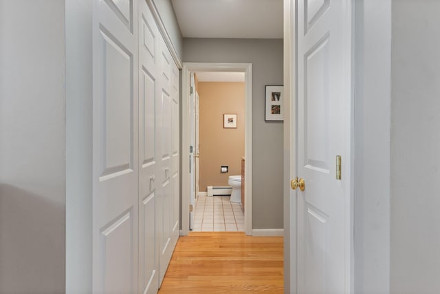 3 Blueberry Rd Unit 3, Yarmouth, ME 04096 - hallway with a baseboard radiator, light wood finished floors, and baseboards