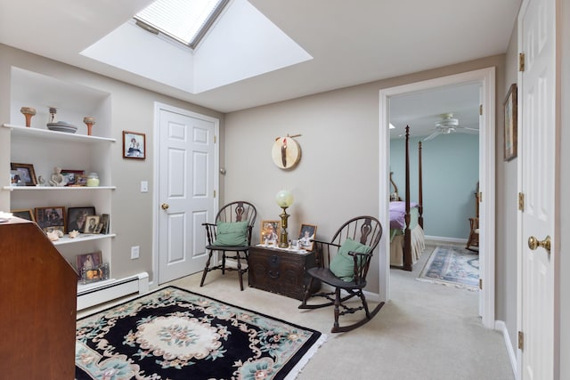3 Blueberry Rd Unit 3, Yarmouth, ME 04096 - sitting room with a baseboard heating unit, light colored carpet, a skylight, a ceiling fan, and baseboards