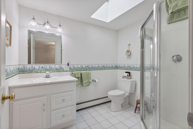 3 Blueberry Rd Unit 3, Yarmouth, ME 04096 - bathroom with baseboard heating, a skylight, a shower stall, vanity, and toilet