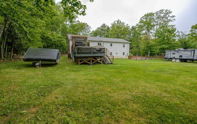 40 Sanborn St, Gorham, ME 04038 - rear view of property with a yard, a deck, a chimney, and view of wooded area