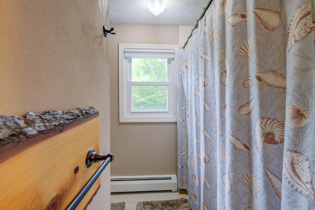 40 Sanborn St, Gorham, ME 04038 - bathroom featuring a baseboard heating unit, tile patterned flooring, a textured ceiling, and a shower with curtain