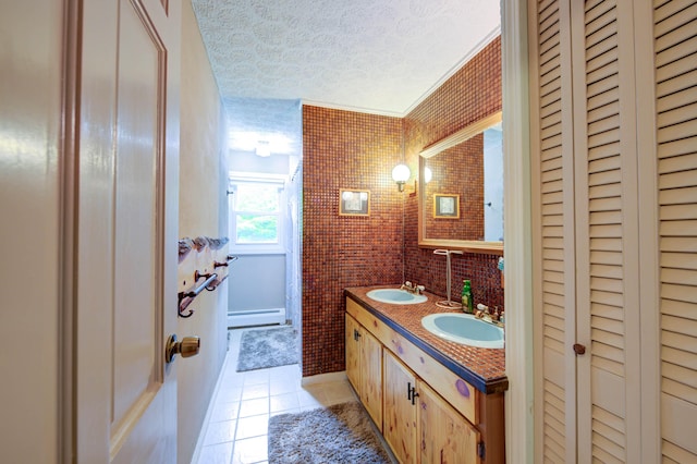 40 Sanborn St, Gorham, ME 04038 - full bath featuring a closet, tile patterned flooring, a textured ceiling, and double vanity