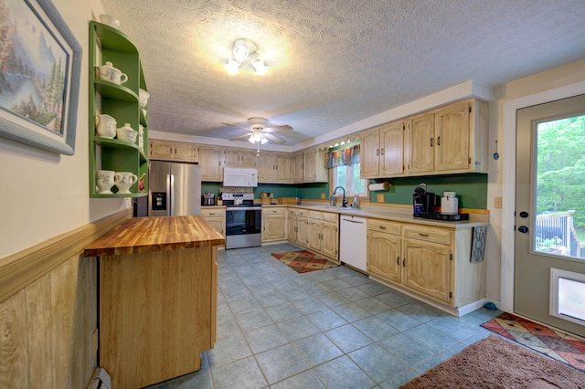 40 Sanborn St, Gorham, ME 04038 - kitchen with stainless steel appliances, a sink, wood counters, a textured ceiling, and a ceiling fan