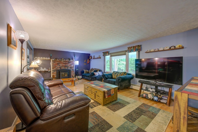 40 Sanborn St, Gorham, ME 04038 - living area with a textured ceiling, a fireplace, and wood finished floors