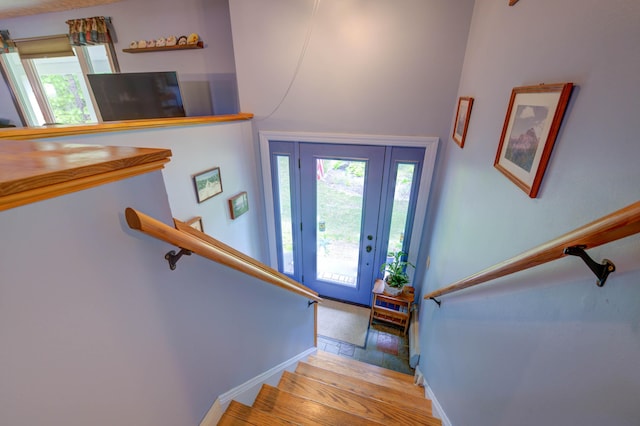 40 Sanborn St, Gorham, ME 04038 - entrance foyer featuring plenty of natural light, stairs, light wood-type flooring, and baseboards