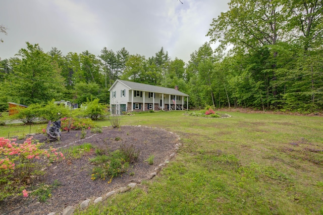 40 Sanborn St, Gorham, ME 04038 - view of front of property featuring a front lawn, a porch, a view of trees, and a chimney