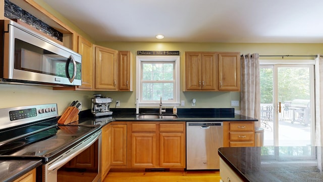 471 Owls Nest Rd, Shapleigh, ME 04076 - kitchen with appliances with stainless steel finishes, a sink, healthy amount of natural light, and light wood-type flooring