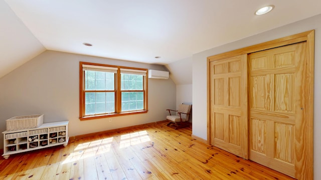 471 Owls Nest Rd, Shapleigh, ME 04076 - bonus room featuring an AC wall unit, lofted ceiling, light wood-type flooring, baseboards, and recessed lighting