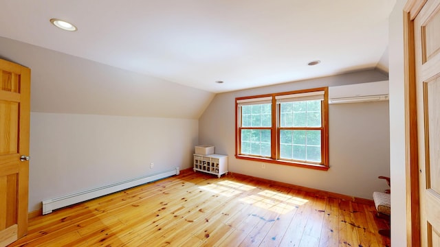 471 Owls Nest Rd, Shapleigh, ME 04076 - additional living space featuring baseboard heating, a wall unit AC, lofted ceiling, light wood-style flooring, and recessed lighting