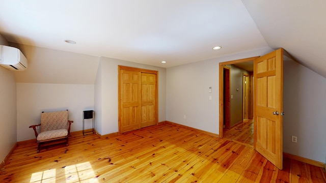471 Owls Nest Rd, Shapleigh, ME 04076 - bonus room featuring light wood-type flooring, a wall mounted air conditioner, lofted ceiling, recessed lighting, and baseboards