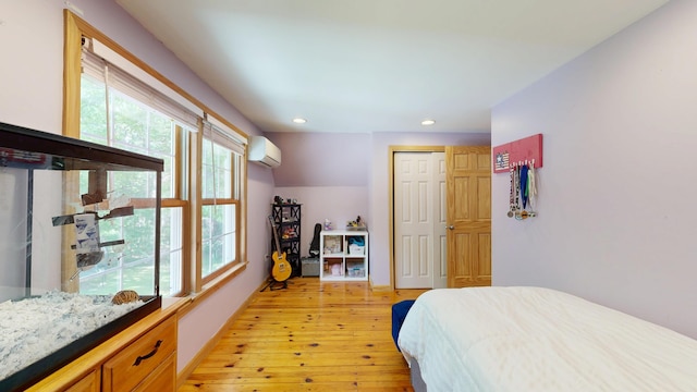 471 Owls Nest Rd, Shapleigh, ME 04076 - bedroom featuring a wall mounted air conditioner, light wood-style flooring, recessed lighting, and a closet