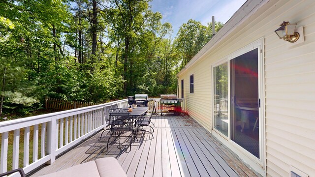 471 Owls Nest Rd, Shapleigh, ME 04076 - wooden terrace with outdoor dining area and area for grilling