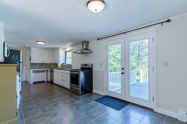 110 Elm St, North Berwick, ME 03906 - kitchen with stainless steel appliances, wall chimney exhaust hood, french doors, white cabinets, and a sink
