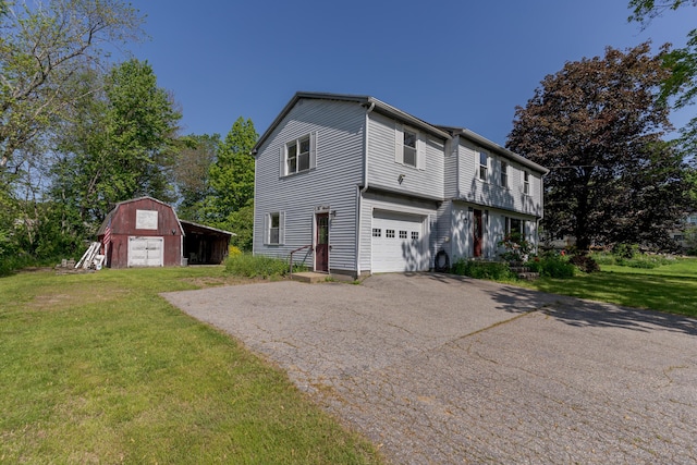 110 Elm St, North Berwick, ME 03906 - view of home's exterior with driveway, a lawn, and an outbuilding