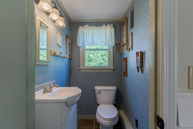 110 Elm St, North Berwick, ME 03906 - half bath featuring vanity, toilet, tile patterned flooring, wallpapered walls, and crown molding