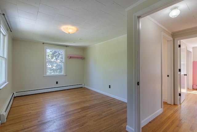 110 Elm St, North Berwick, ME 03906 - unfurnished room with wood finished floors, baseboard heating, ornamental molding, and baseboards