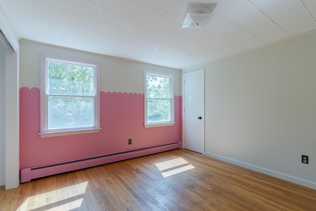 110 Elm St, North Berwick, ME 03906 - empty room featuring a baseboard radiator, wood finished floors, and baseboards