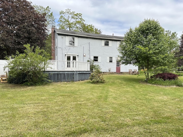 110 Elm St, North Berwick, ME 03906 - rear view of property with a deck, a chimney, and a yard