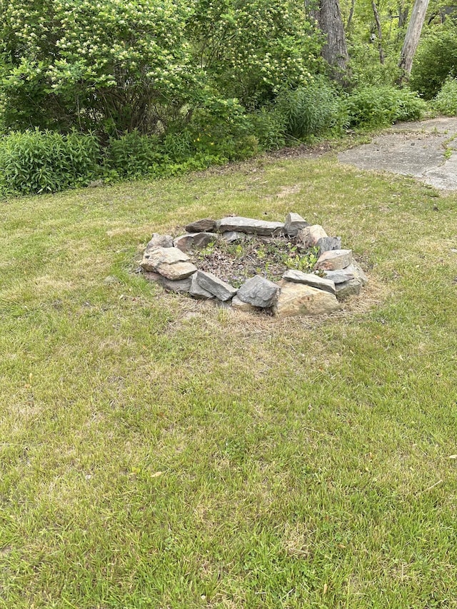110 Elm St, North Berwick, ME 03906 - view of green lawn featuring an outdoor fire pit