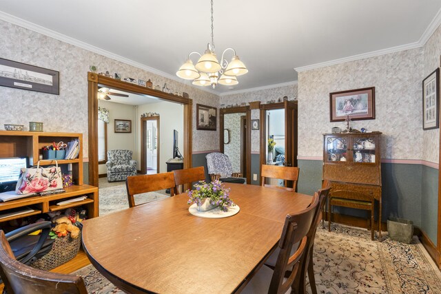 94 Union St, Bath, ME 04530 - dining space with wallpapered walls, a chandelier, and crown molding