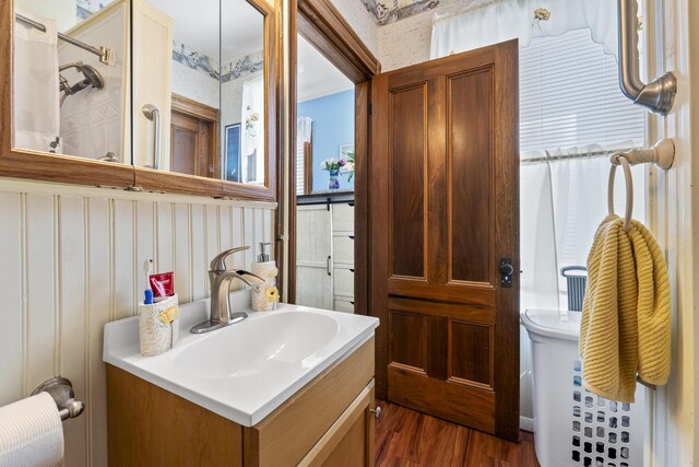 94 Union St, Bath, ME 04530 - bathroom with wood finished floors, a shower, and vanity