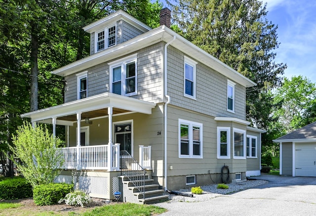 24 Western Ave, Auburn, ME 04210 - american foursquare style home featuring covered porch, a chimney, an outdoor structure, and driveway