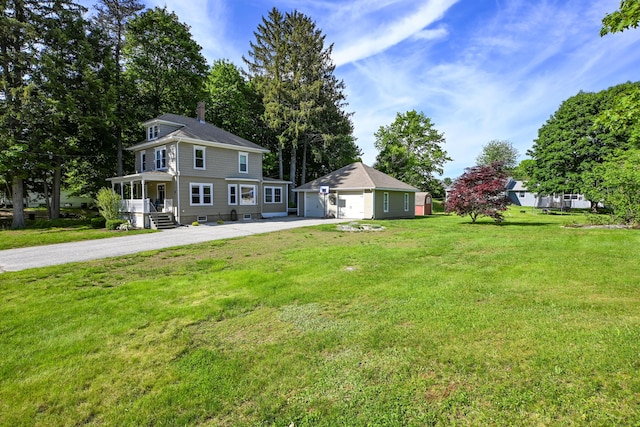24 Western Ave, Auburn, ME 04210 - view of green lawn featuring an outdoor structure and a detached garage