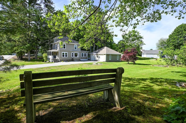24 Western Ave, Auburn, ME 04210 - view of grassy yard featuring an outbuilding and a garage