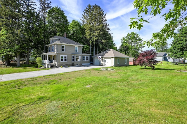 24 Western Ave, Auburn, ME 04210 - view of grassy yard with an outbuilding and a garage