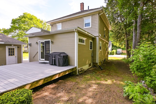 24 Western Ave, Auburn, ME 04210 - back of house with a chimney and a deck