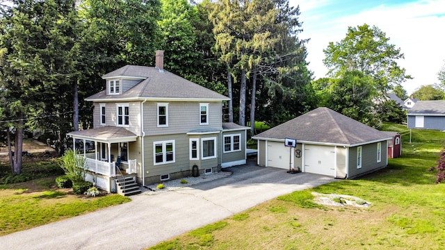 24 Western Ave, Auburn, ME 04210 - view of front of property with an outbuilding, a garage, covered porch, a chimney, and a front lawn