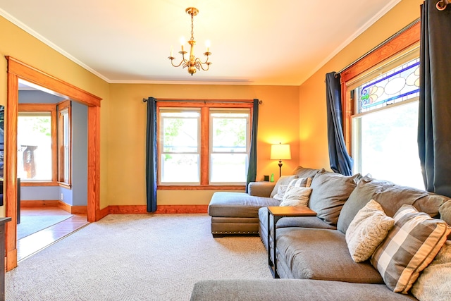 24 Western Ave, Auburn, ME 04210 - carpeted living room with healthy amount of natural light, a chandelier, baseboards, and crown molding