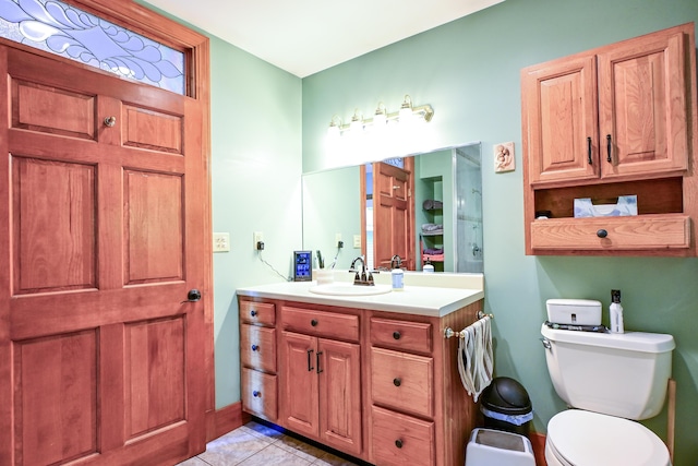 24 Western Ave, Auburn, ME 04210 - bathroom featuring vanity, tile patterned floors, toilet, and baseboards