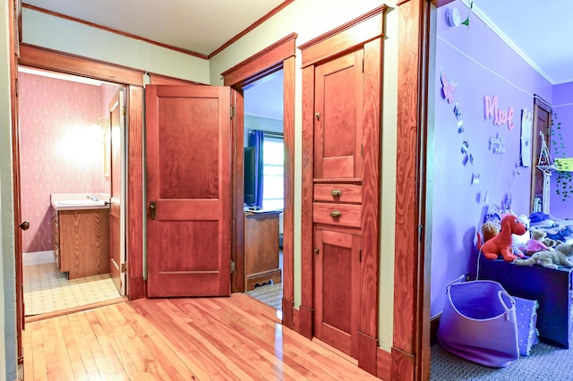 24 Western Ave, Auburn, ME 04210 - hall featuring ornamental molding, wood-type flooring, and a sink