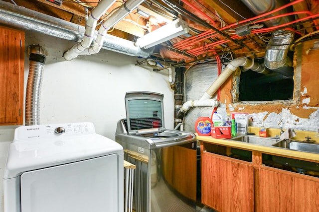 24 Western Ave, Auburn, ME 04210 - unfinished below grade area featuring independent washer and dryer and a sink