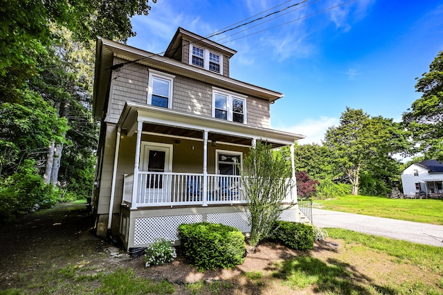 24 Western Ave, Auburn, ME 04210 - traditional style home featuring a porch and a front yard