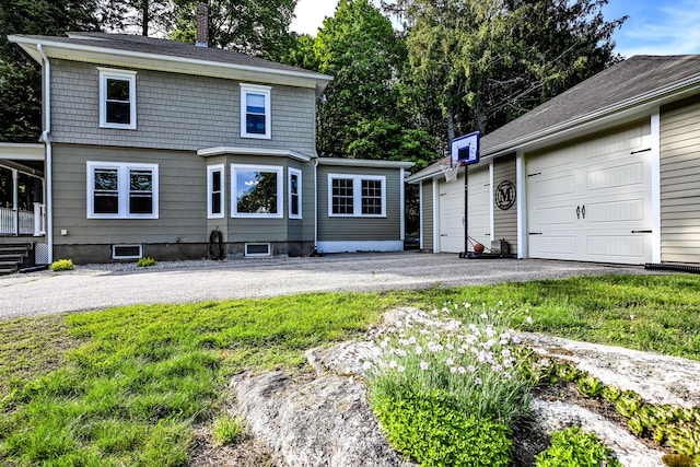 24 Western Ave, Auburn, ME 04210 - view of front facade with a garage, a chimney, and a front yard
