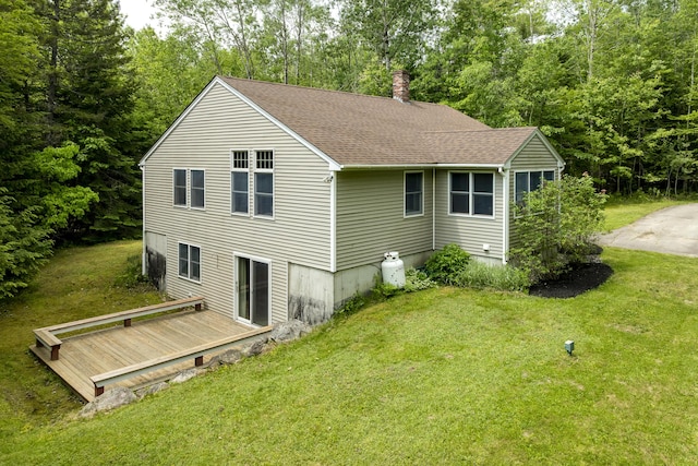 27 Russell Ln, Damariscotta, ME 04543 - back of property with a deck, a chimney, a yard, and a shingled roof