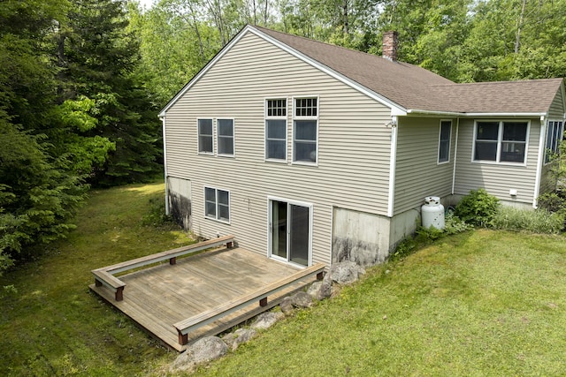 27 Russell Ln, Damariscotta, ME 04543 - back of property featuring a lawn, a wooden deck, a chimney, and a shingled roof