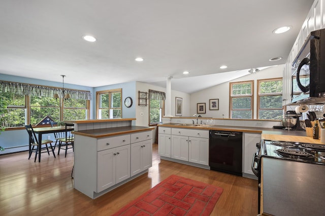 27 Russell Ln, Damariscotta, ME 04543 - kitchen with black appliances, butcher block countertops, light wood-type flooring, white cabinetry, and a peninsula