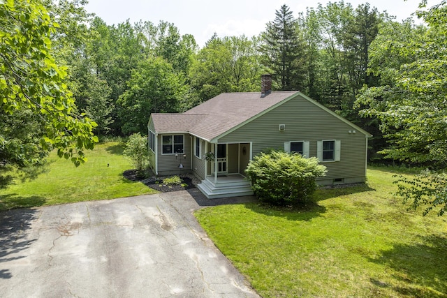 27 Russell Ln, Damariscotta, ME 04543 - view of front of property featuring a front yard, a chimney, roof with shingles, and driveway