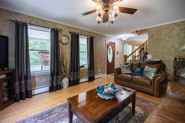 76 Punkintown Rd, Eliot, ME 03903 - living area with wood finished floors, ceiling fan, wallpapered walls, stairway, and ornamental molding
