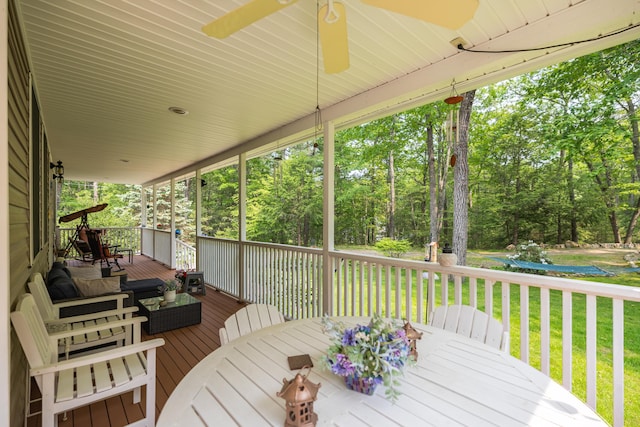 76 Punkintown Rd, Eliot, ME 03903 - wooden deck featuring a yard, view of scattered trees, a ceiling fan, and outdoor dining area