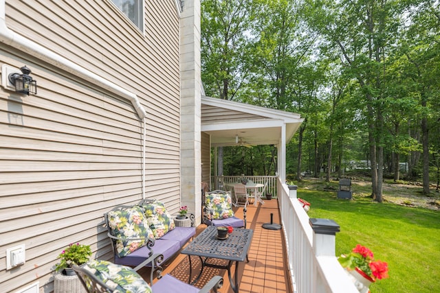 76 Punkintown Rd, Eliot, ME 03903 - deck featuring a lawn, outdoor dining space, and a ceiling fan