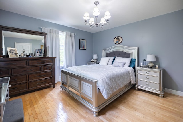 76 Punkintown Rd, Eliot, ME 03903 - bedroom with a chandelier and light wood finished floors