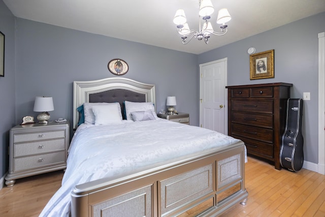 76 Punkintown Rd, Eliot, ME 03903 - bedroom with a chandelier and light wood-style flooring