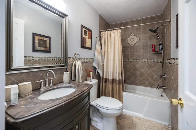76 Punkintown Rd, Eliot, ME 03903 - bathroom featuring tile walls, shower / bath combo, vanity, a textured ceiling, and tile patterned floors